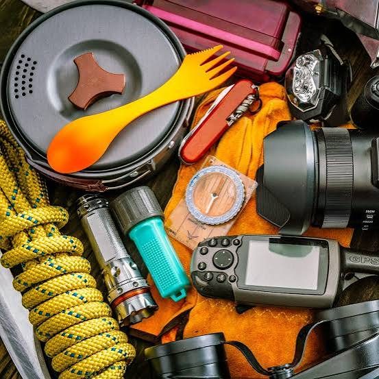 Camp kitchen and navigation tools including cook pot, spork, headlamp, compass and GPS